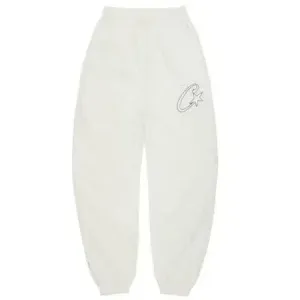 Pantaloni tuta Corteiz Satin C Star bianco panna